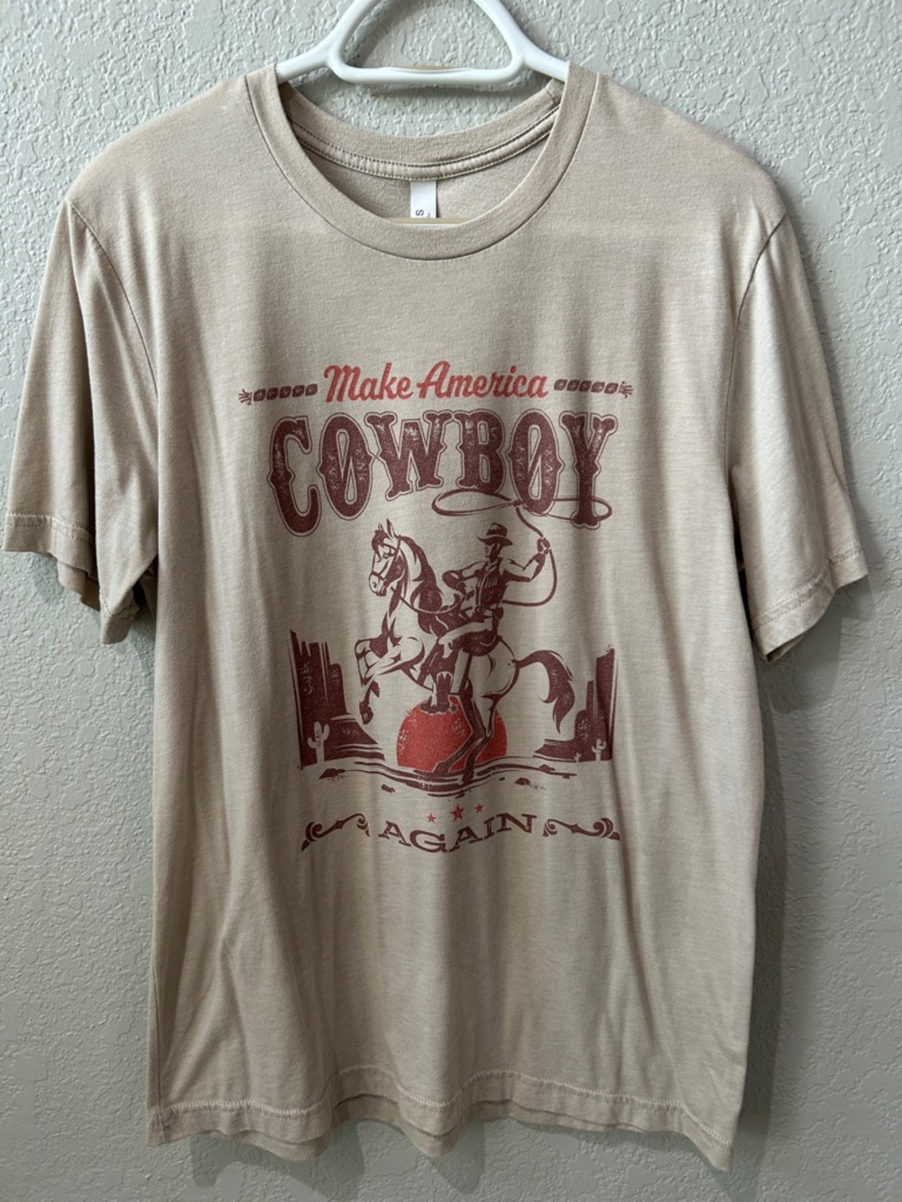 Make America Cowboy Again Graphic Tee - Beige with Rust Red Print